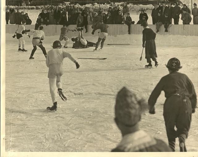 Winter carnival, firemans broom hockey, notice it was on skates back then